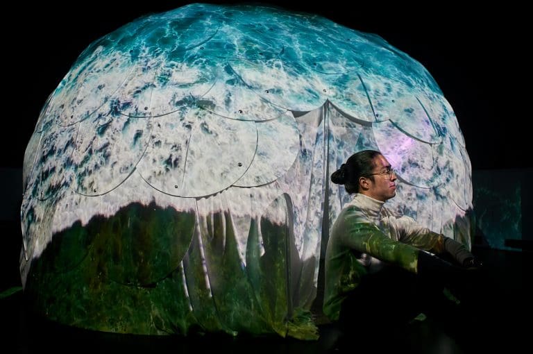 Undergraduate Kora Kwok with his installation "Ocean Room."