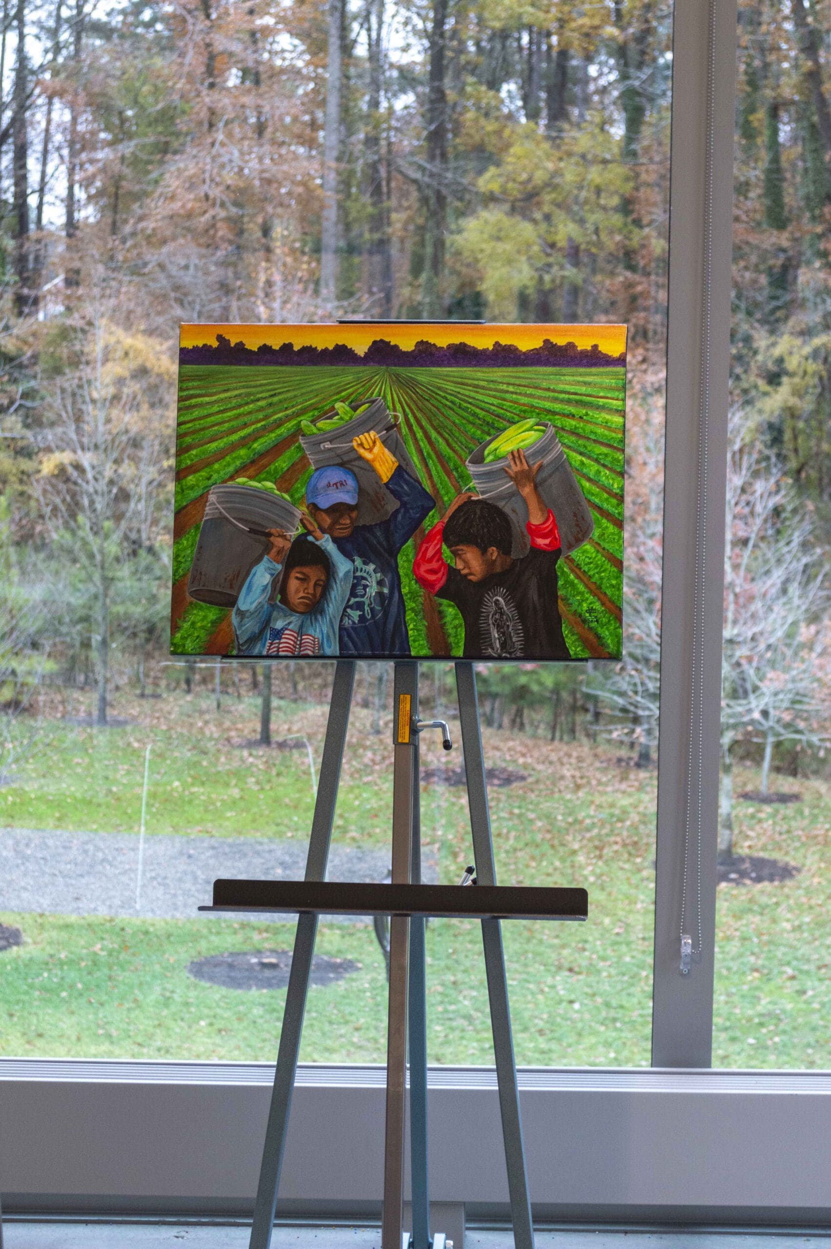 A canvas showing a farmworker on an easel.