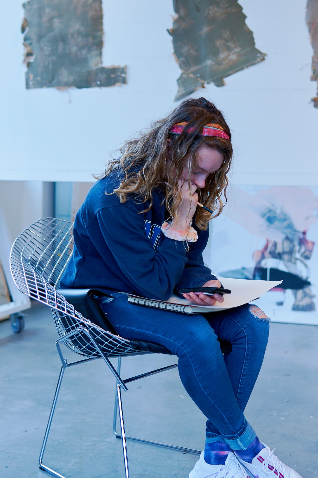 Seated student preparing to draw