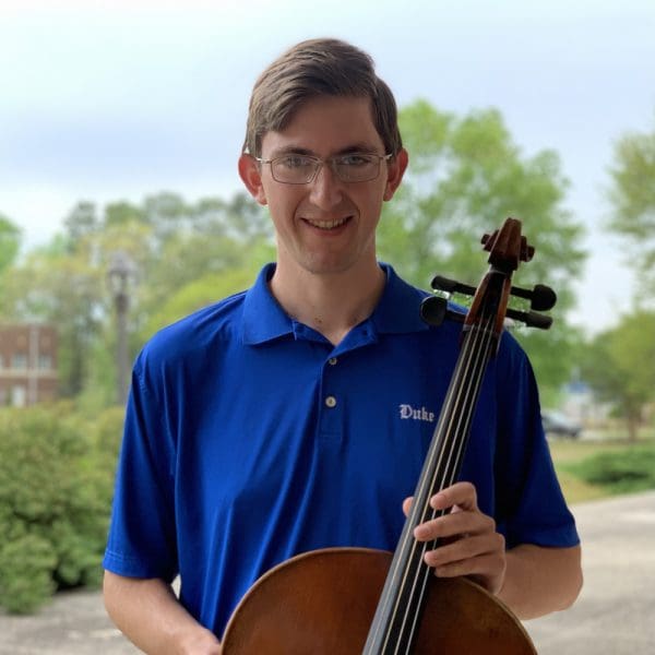 Benson awardee Jacob with a violin
