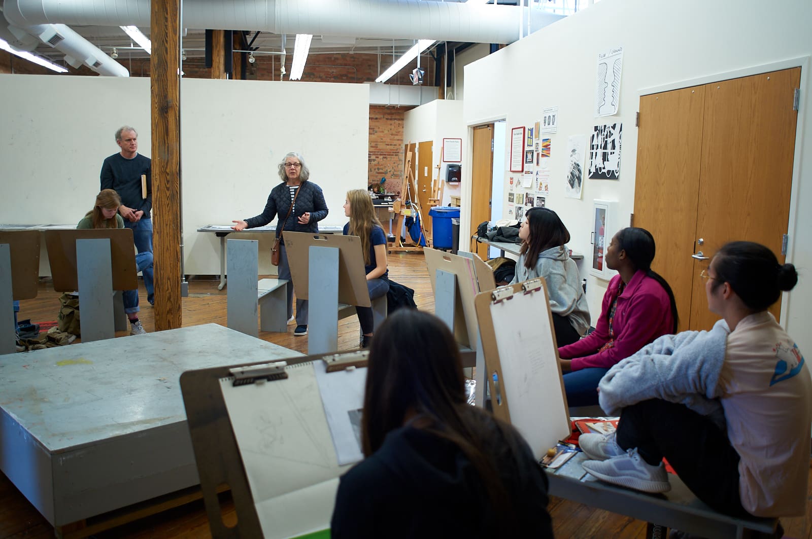 Maira Kalman speaks to drawing students as Bill Fick looks on