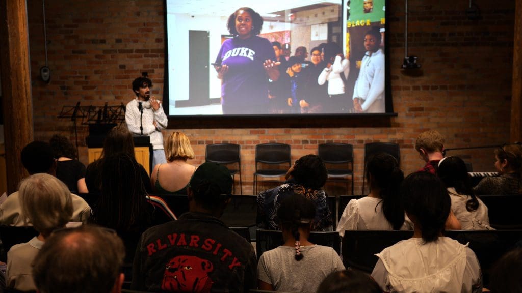 A young adult student giving a presentation