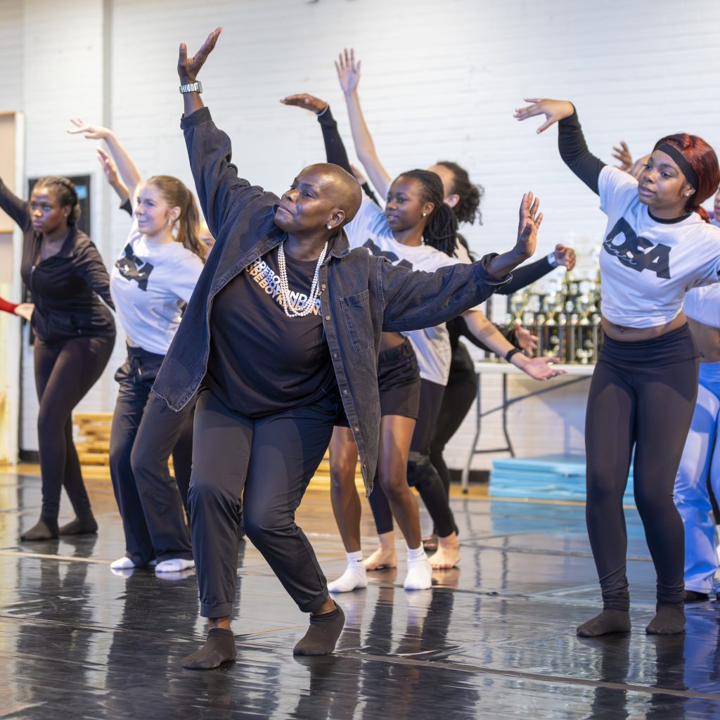 A group of highs chool students practicing dance