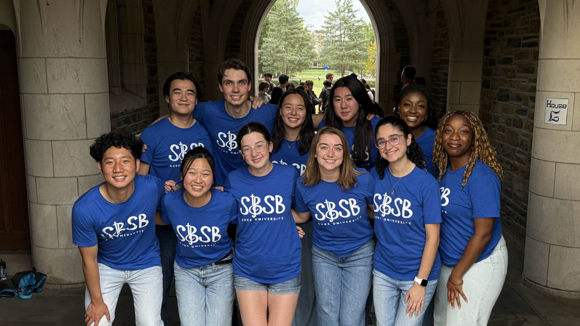 A group of young adult students wearing blue t-shirts